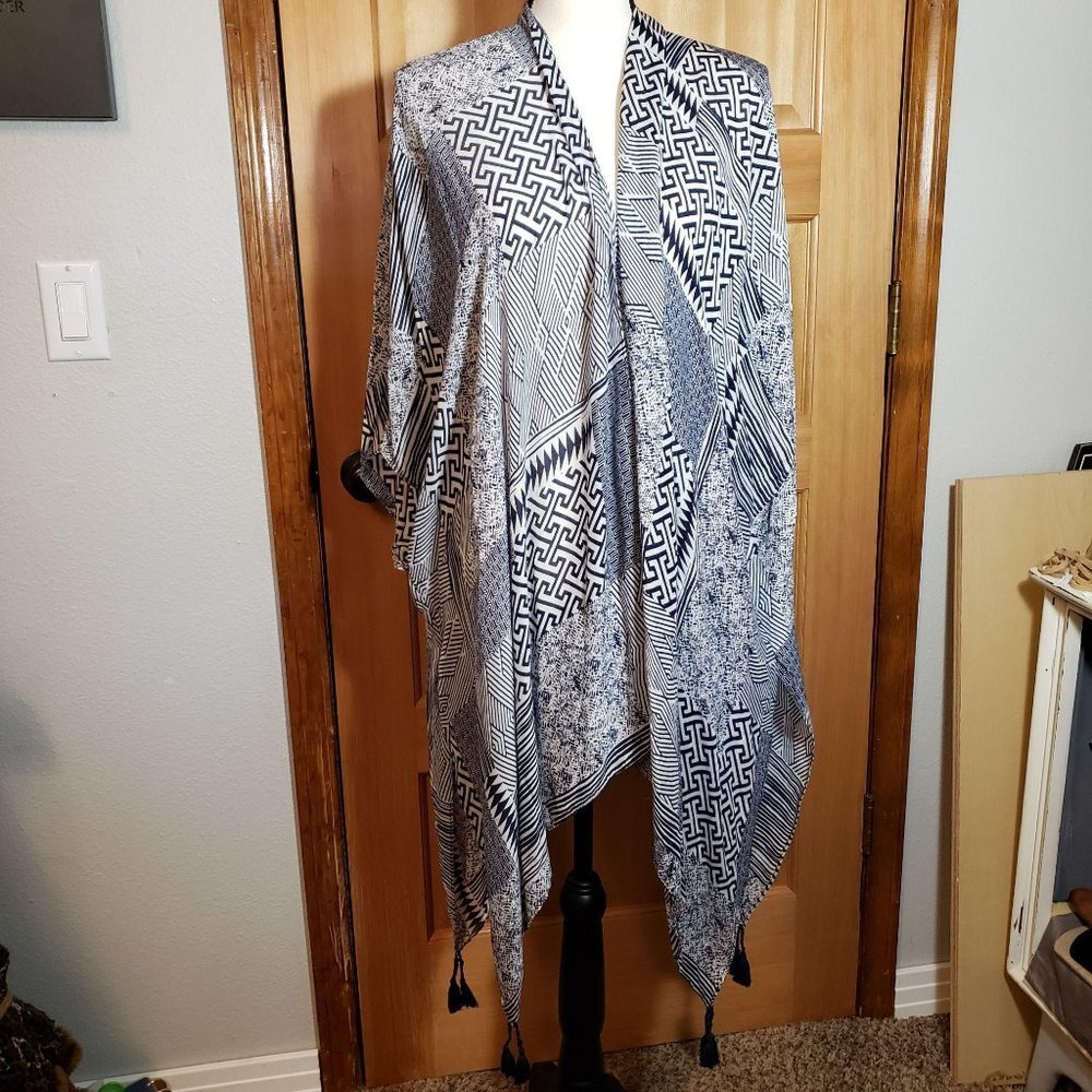 Top it off, swimsuit cover with tassels‎